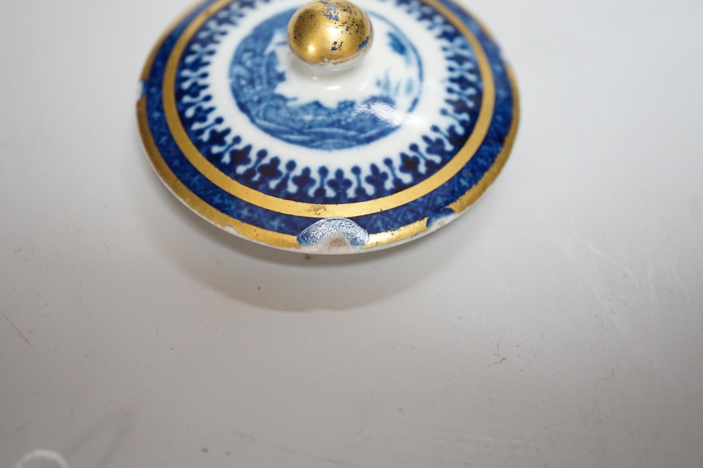 An 18th century Caughley tea canister and cover printed with Willow Nankin pattern,12.5cms high